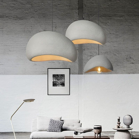 Jusole Lights – Kumo – Wabi-sabi inspired pendant light with handcrafted organic silhouette, available in matte white or gray finish; features textured ceramic-like surface and soft diffused lighting for a serene, minimalist atmosphere.