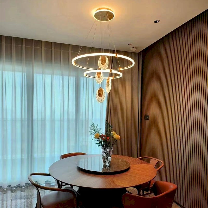 Celestia pendant light with golden aluminum frame and acrylic shades, dimmable with 3 color temperatures, perfect for living rooms, dining areas, and bedrooms.