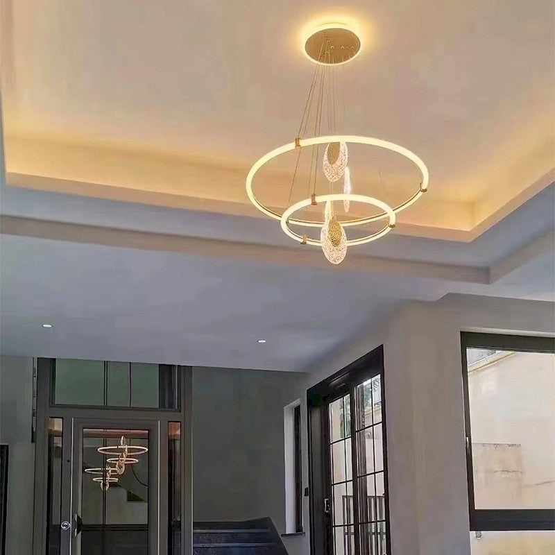 Celestia pendant light with golden aluminum frame and acrylic shades, dimmable with 3 color temperatures, perfect for living rooms, dining areas, and bedrooms.