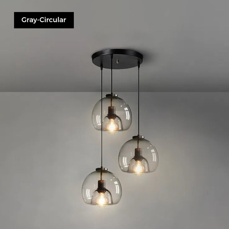 Jusole Lights - Glimmer - three-head pendant light in circular cluster or linear bar style, with gray, amber, or clear glass shades and warm or cool E27 LED illumination.