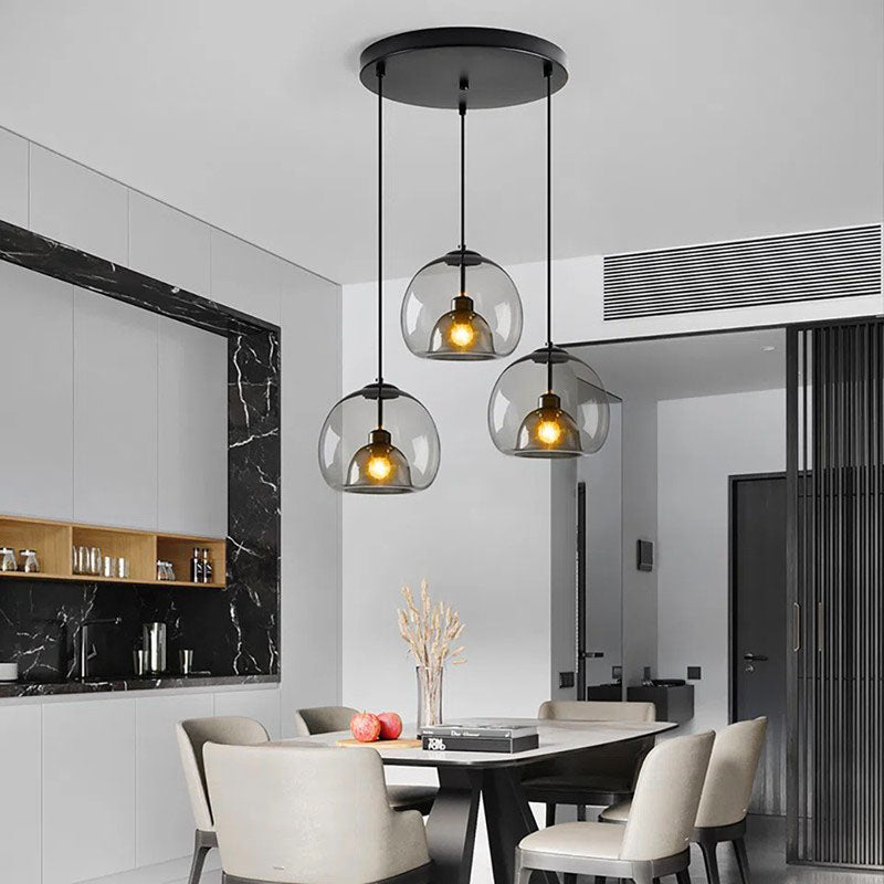 Jusole Lights - Glimmer - three-head pendant light in circular cluster or linear bar style, with gray, amber, or clear glass shades and warm or cool E27 LED illumination.