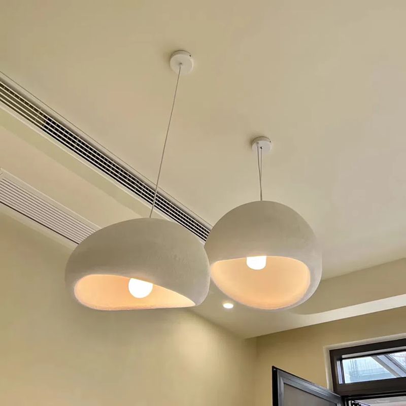 Jusole Lights – Kumo – Wabi-sabi inspired pendant light with handcrafted organic silhouette, available in matte white or gray finish; features textured ceramic-like surface and soft diffused lighting for a serene, minimalist atmosphere.