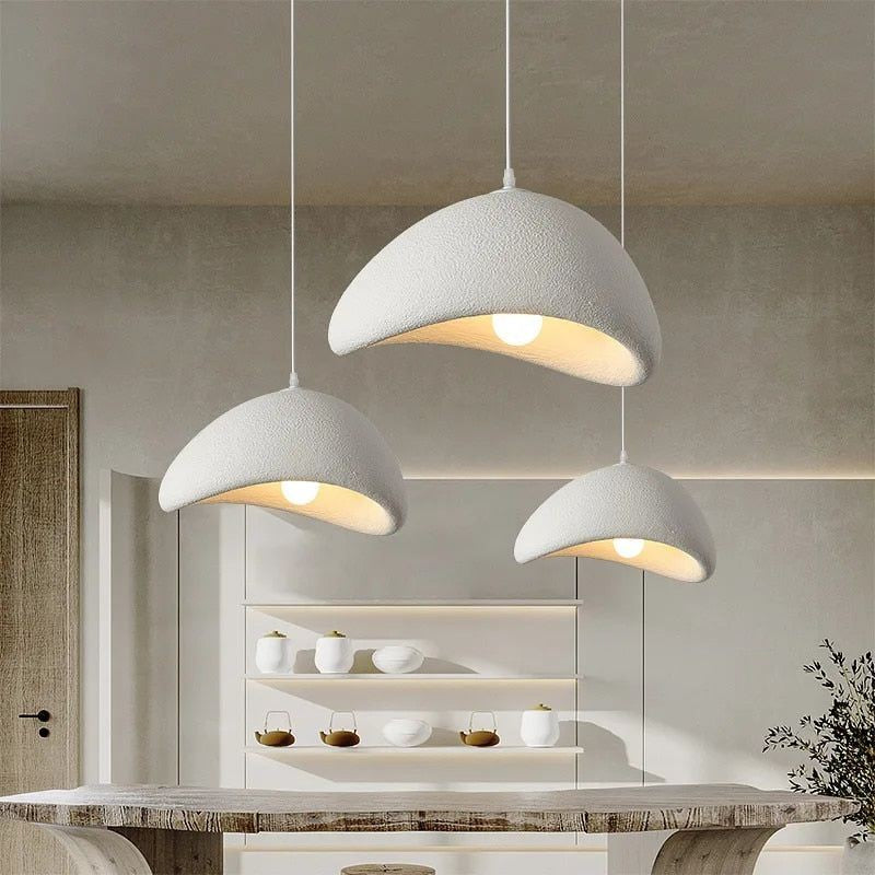 Jusole Lights – Kumo – Wabi-sabi inspired pendant light with handcrafted organic silhouette, available in matte white or gray finish; features textured ceramic-like surface and soft diffused lighting for a serene, minimalist atmosphere.
