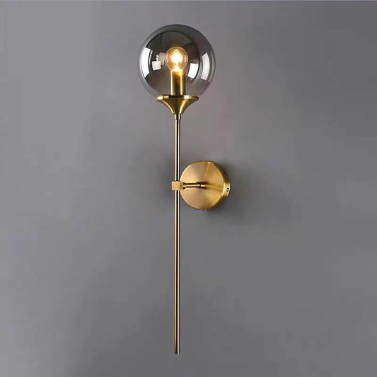 Jusole Lights - Torch - Nordic modern LED wall lamp with brass finish and glass globe. Available in smoky gray, transparent, and amber. E14 socket, warm glow for elegant interiors.