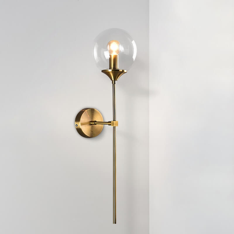 Jusole Lights - Torch - Nordic modern LED wall lamp with brass finish and glass globe. Available in smoky gray, transparent, and amber. E14 socket, warm glow for elegant interiors.