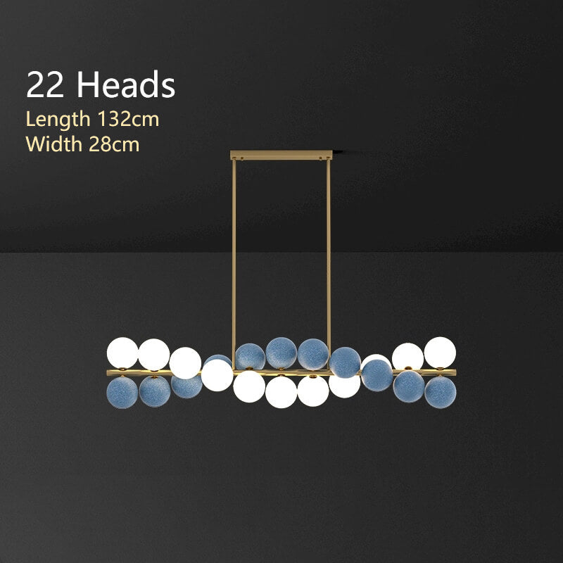 Zephyr Luxury Nordic Chandelier with full brass body and glass globe shades, featuring stepless dimming, suitable for dining room, living room, and designer interiors.